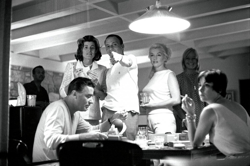 frank-sinatra-patricia-kennedy-lawford-marilyn-monroe-and-peter-lawford-play-with-a-new-polaroid-camera-may-britt-is-in-background-photo-by-bernie-abramson